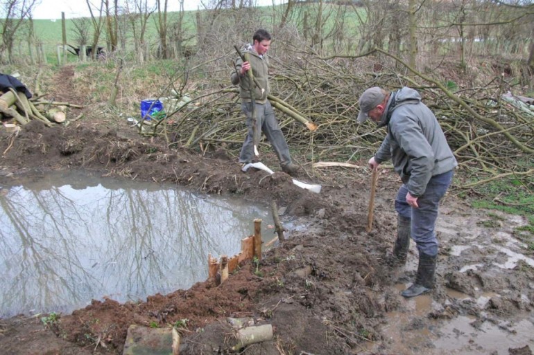 Richard Baines and Dan Lombard create a pond in Old Fall Plantation March 2010